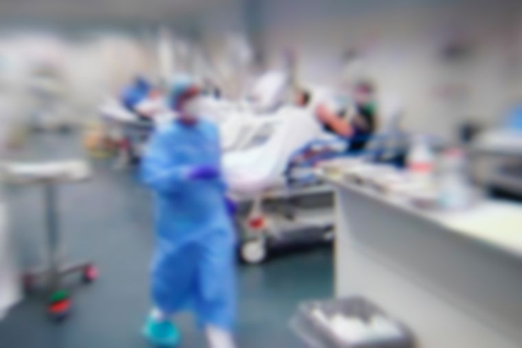 Blurred of patient with Coronavirus disease,COVID-19 and treatment at ward in the hospital.