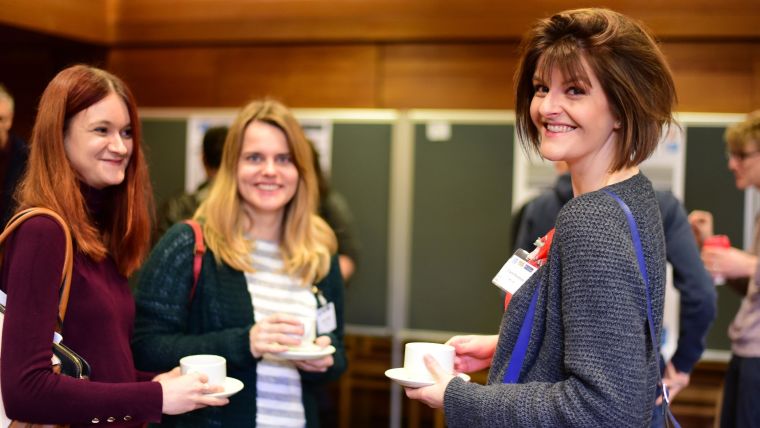 Photo of the 2019 MRC WIMM Postdoc Symposium, showing three postdocs smiling.